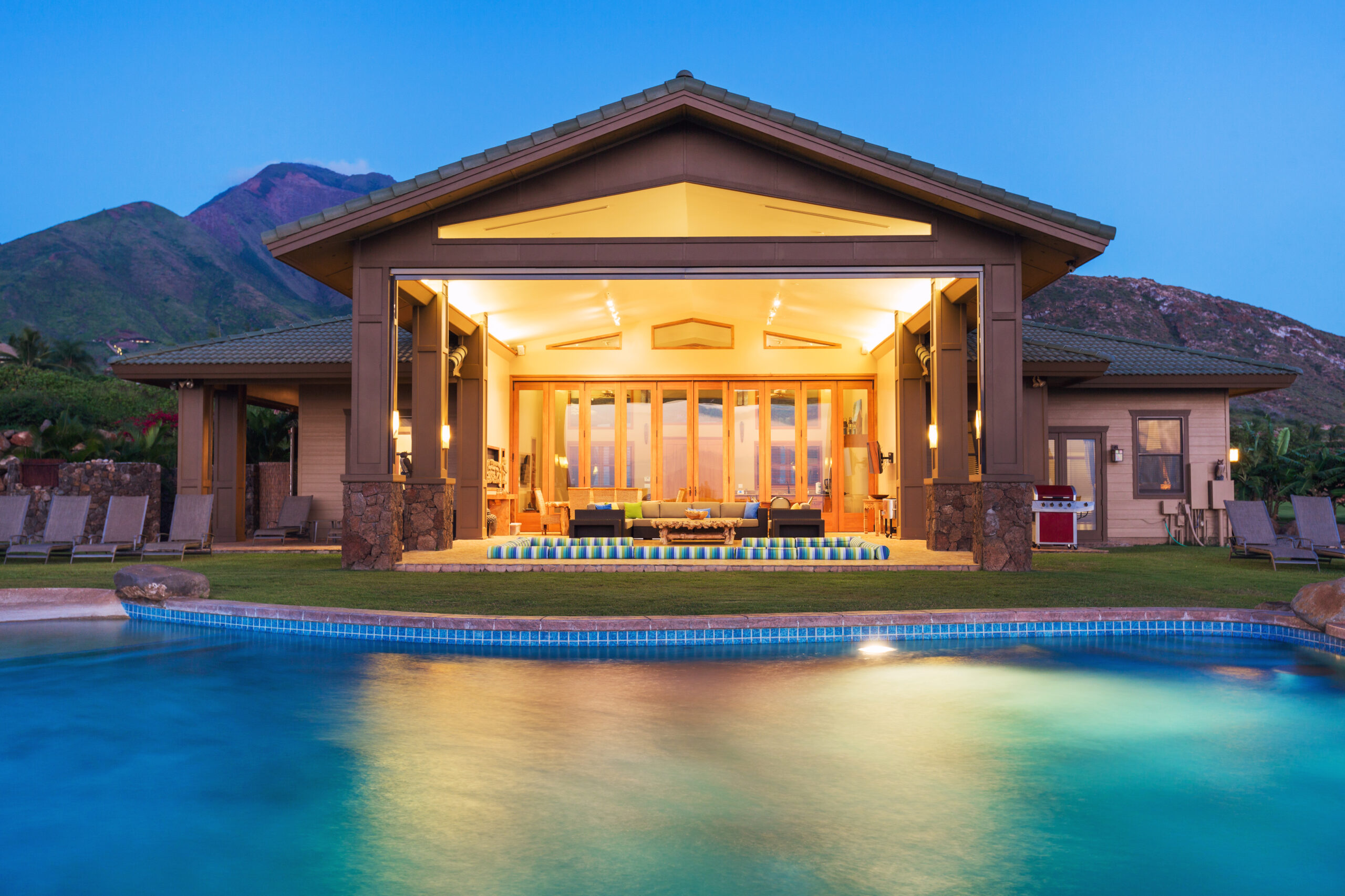Luxury home with swimming pool at sunset